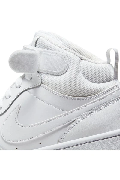 Shop Nike Kids' Court Borough Mid 2 Basketball Shoe In White/ White