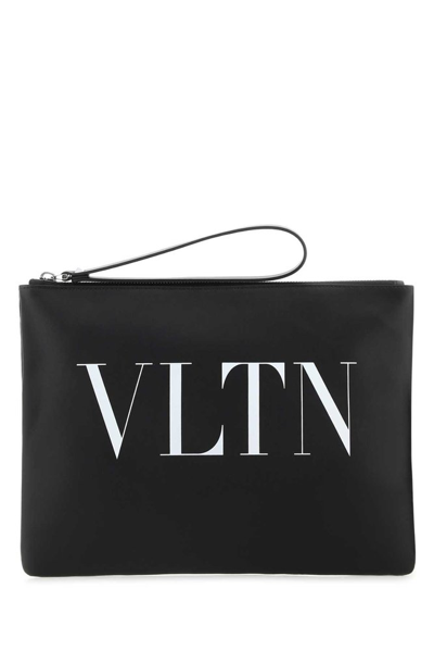 Shop Valentino Logo Printed Zipped Clutch Bag In Black