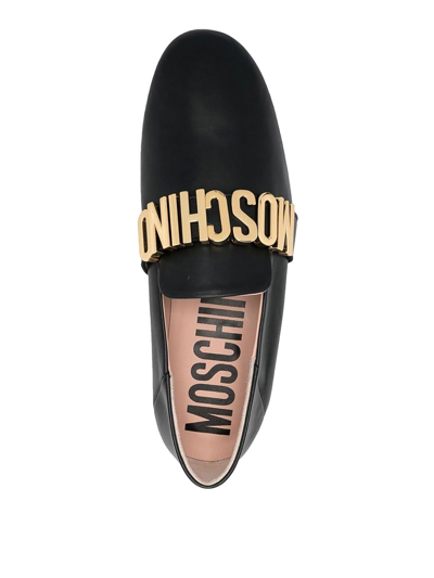 Shop Moschino Metallic Letters Loafers In Black