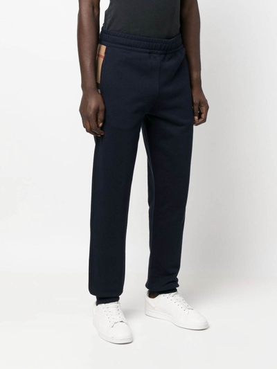 Shop Burberry Check-panelled Track Pants In Blue