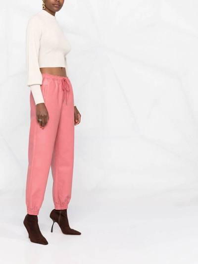 Shop Stella Mccartney Faux-leather Tapered Trousers In Nude & Neutrals