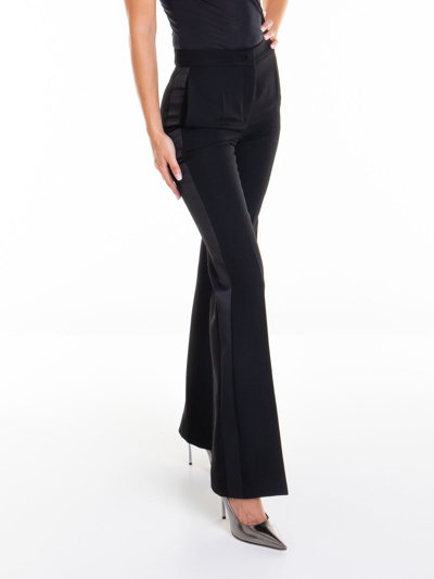 Shop Moschino Flared Pants In Black