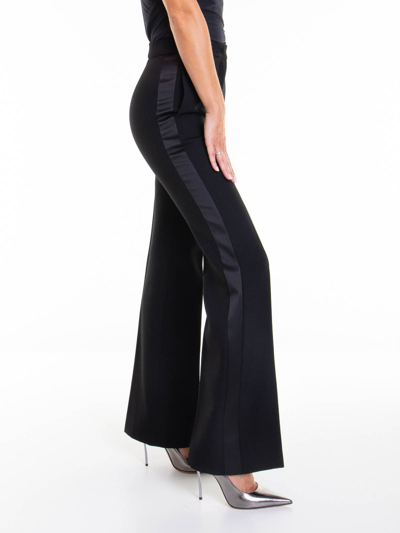 Shop Moschino Flared Pants In Black