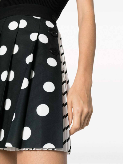 Shop Msgm Polka Dot Pleated Mini Skirt In White