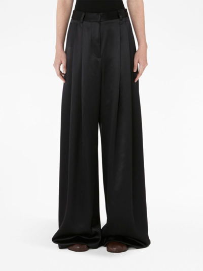 Shop Jw Anderson High-rise Wide-leg Trousers In Black