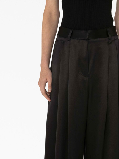 Jw Anderson Wide-leg Pleated Pants In Black