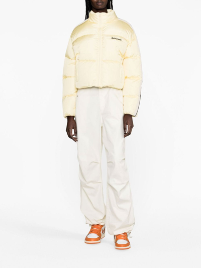 Shop Palm Angels Logo-embroidered Puffer Jacket In Amarillo Claro