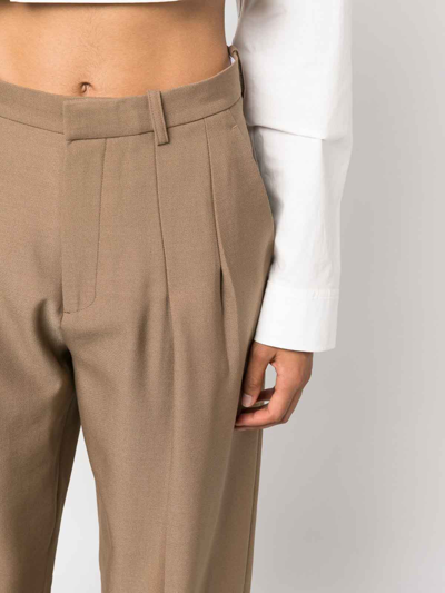 Shop Victoria Beckham Cotton-blend Pleated Pants In Brown