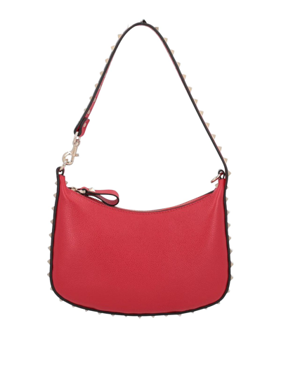 Shop Valentino Rockstud Mini Hobo Bag In Leather In Red
