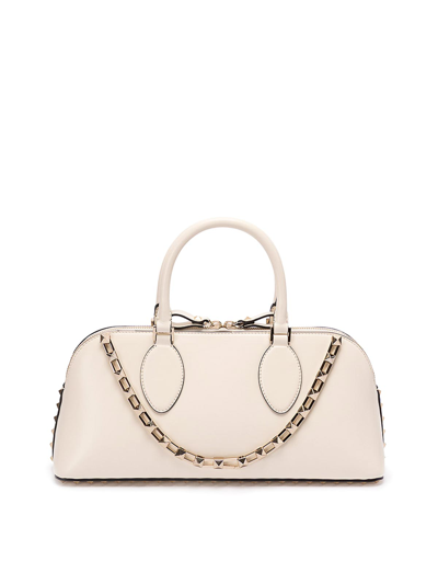 Shop Valentino `rockstud` Medium Leather Duffle Bag In White