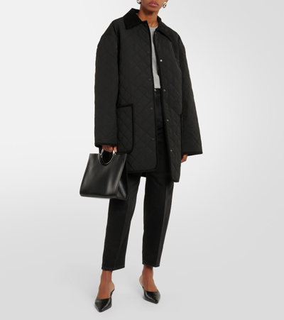 Totême Mid-rise Tapered Jeans In Black