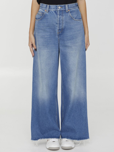 Shop Gucci Frayed Hem Wide Leg Jeans In Blue