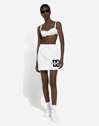 Dolce & Gabbana Jersey Miniskirt With Dg Logo Patch In ホワイト