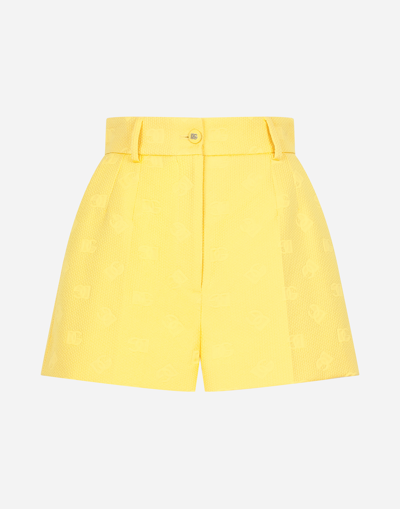 Shop Dolce & Gabbana Jacquard Shorts With All-over Dg Logo In Yellow