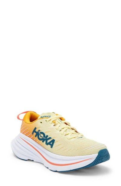 Shop Hoka Bondi X Running Shoe In Yellow Pear / Radiant Yellow