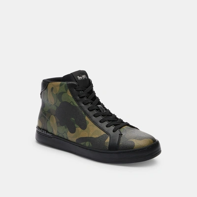 Shop Coach Outlet Clip High Top Sneaker In Signature Canvas With Camo Print In Green
