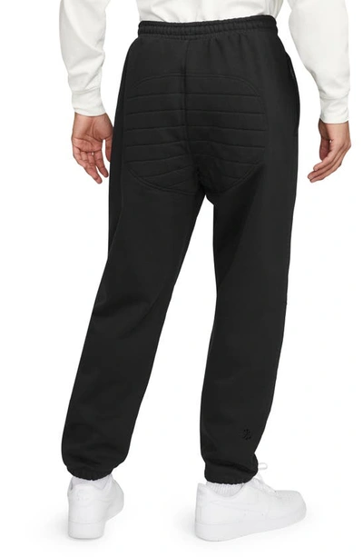 Shop Nike Therma-fit Tech Pack Water Repellent Fleece Sweatpants In Black/ Black