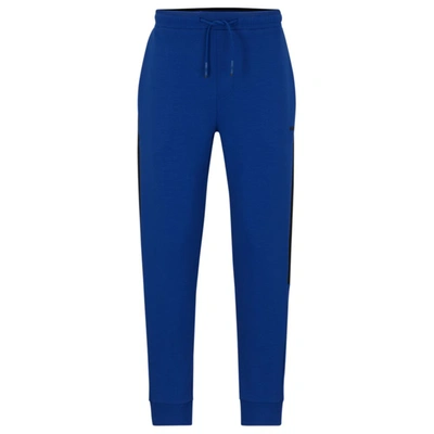 Shop Hugo Boss Cotton-blend Tracksuit Bottoms With Side-stripe Tape In Blue
