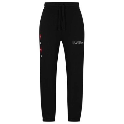 Shop Hugo Cotton-terry Tracksuit Bottoms With Playing-card Artwork In Black