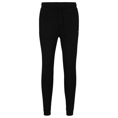 Shop Hugo Boss Cotton Tracksuit Bottoms With Curved Logo In Black
