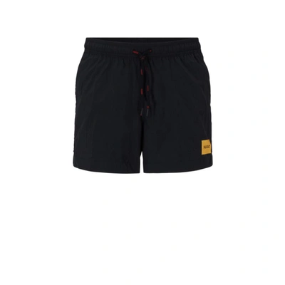 Shop Hugo Quick-dry Swim Shorts With Red Logo Label In Black