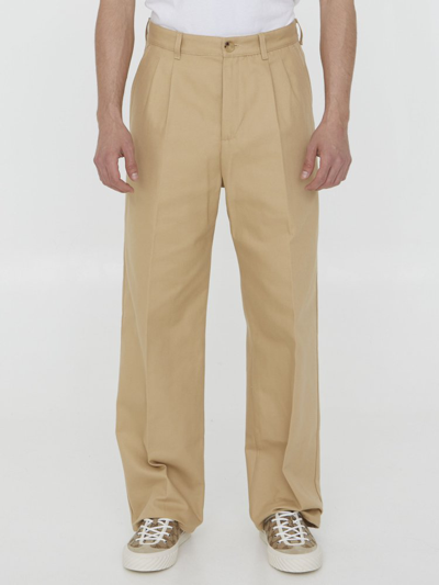 Shop Gucci Logo Embroidered Pressed Crease Trousers In Beige