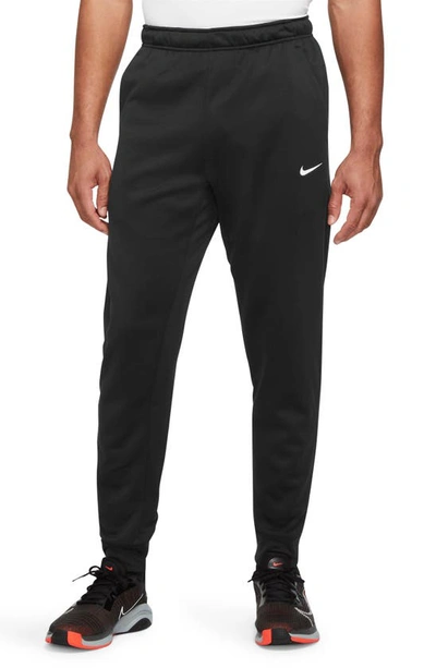 Shop Nike Therma-fit Tapered Training Pants In Black/ Black/ White