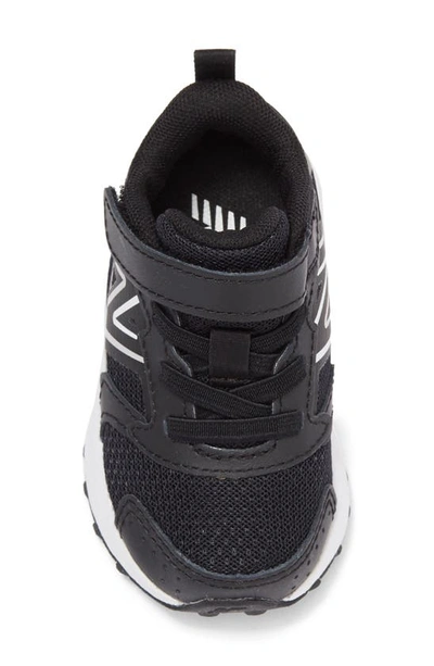 Shop New Balance Kids' 650 Sneaker In Black/ Metallic Silver