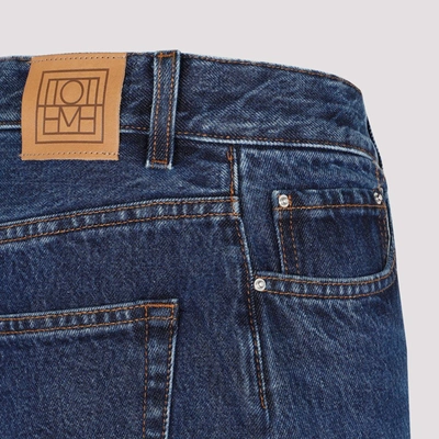 Shop Totême Wide Tapered Leg Denim Jeans In Blue