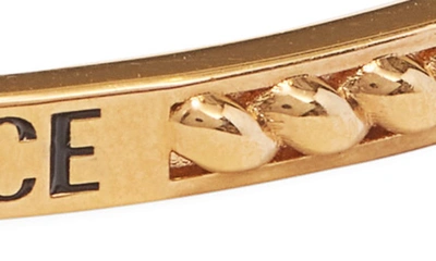 Shop Versace Logo Debossed Cuff Bracelet In  Gold