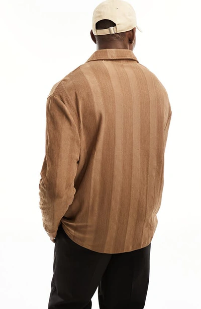 Shop Asos Design Relaxed Fit Long Sleeve Polo In Brown
