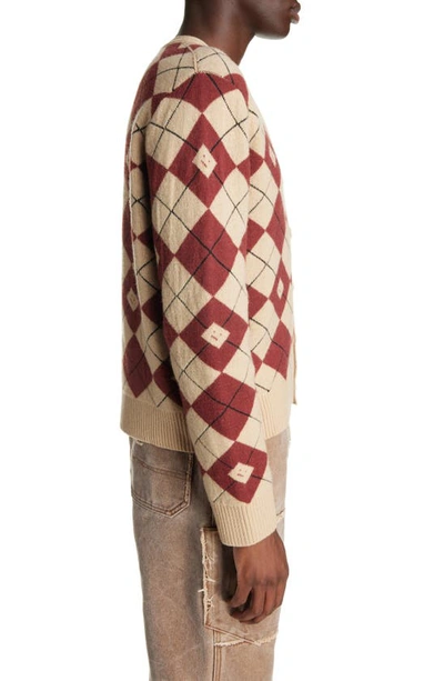 Shop Acne Studios Face Logo Argyle Jacquard Wool Blend V-neck Sweater In Biscuit Beige/ Deep Red