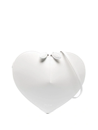 Shop Alaïa Le Cœur Luxurious Calfskin Crossbody Bag In White