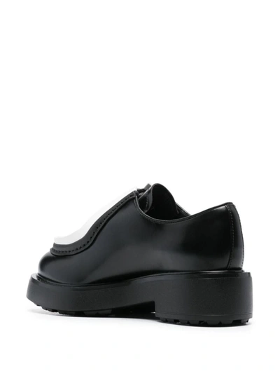 Shop Prada Contrasting-trim Leather Shoes In Nero+bianco