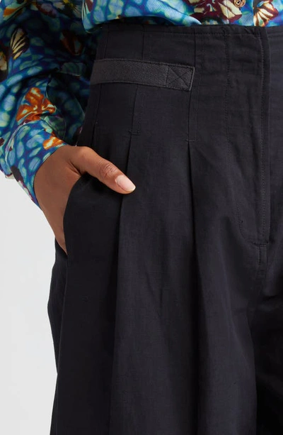 Shop Ulla Johnson Alda Pleated Tapered Pants In Noir