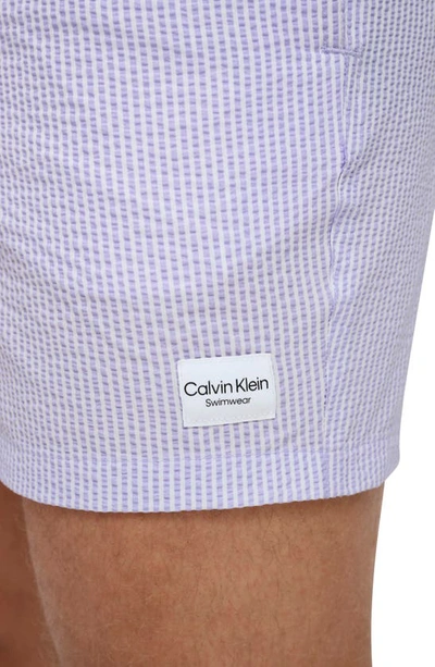 Shop Calvin Klein Modern Euro Seersucker Swim Trunks In Lavender