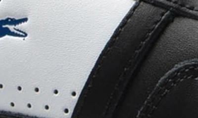 Shop Lacoste T-clip Sneaker In White/ Black