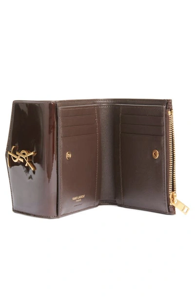 Shop Saint Laurent Cassandre Uptown Patent Leather Trifold Wallet In Ir Brown/ Dark Nut Brown