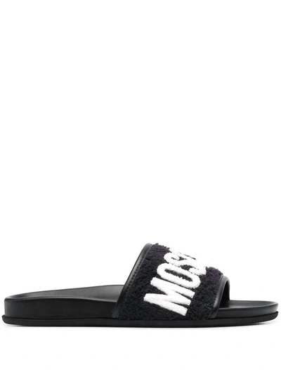 Shop Moschino Terry Logo Leather Slides In Black