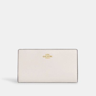 Shop Coach Outlet Slim Zip Wallet In Gold