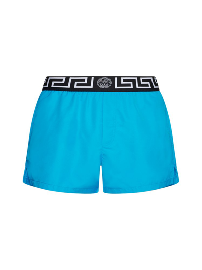 Shop Versace Greca Logo Waistband Swim Shorts In Blue