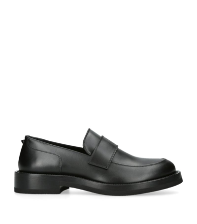 Shop Valentino Leather Logo-embossed Loafers In Black