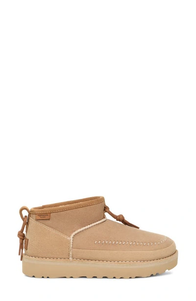 Shop Ugg Gender Inclusive Ultra Mini Crafted Regenerate Genuine Shearling Lined Bootie In Sand