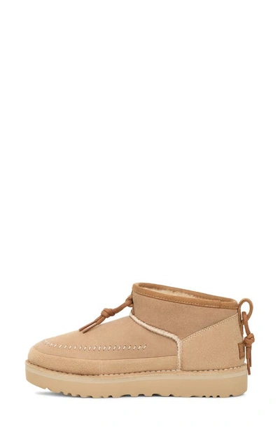 Shop Ugg Gender Inclusive Ultra Mini Crafted Regenerate Genuine Shearling Lined Bootie In Sand