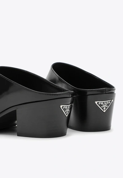 Shop Prada 55 Logo Leather Mules In Black