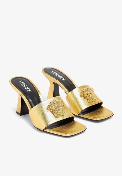 Shop Versace 70 Medusa Mules In Metallic Leather In Gold