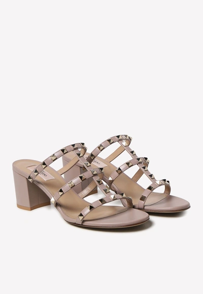 Shop Valentino 70 Rockstud Leather Mules In Beige