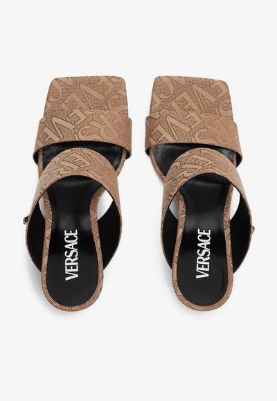 Shop Versace 95 All-over Logo Mules In Brown