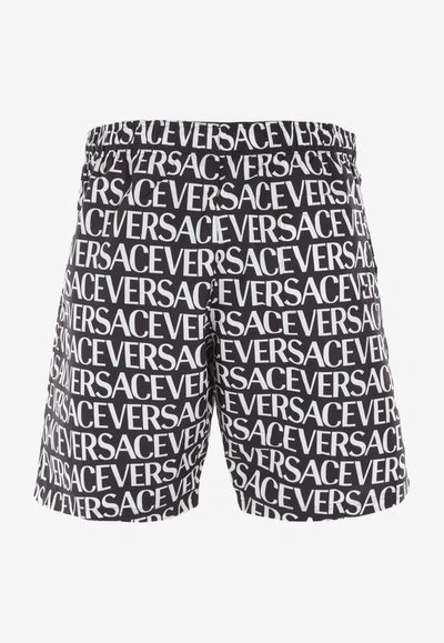 Shop Versace All-over Logo Bermuda Shorts In Monochrome
