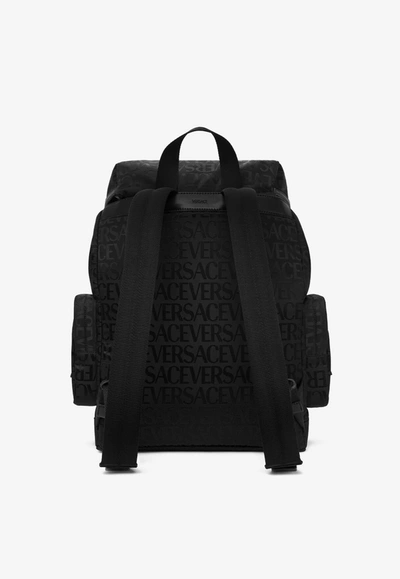 Shop Versace All-over Logo Jacquard Backpack In Black